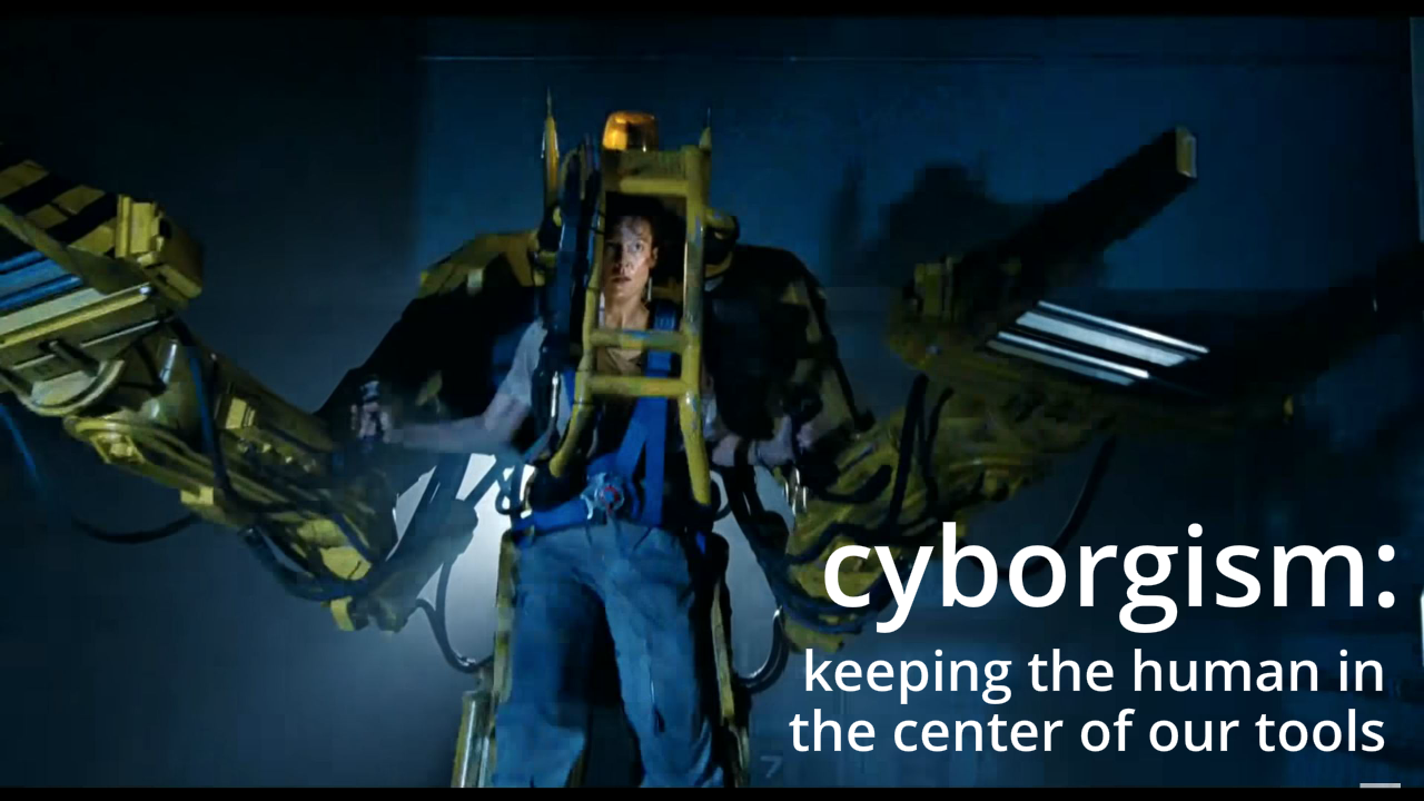 Screenshot of Sigourney Weaver from Alien in the Power Loader. Caption: "cyborgism: keeping the human in the center of our tools"